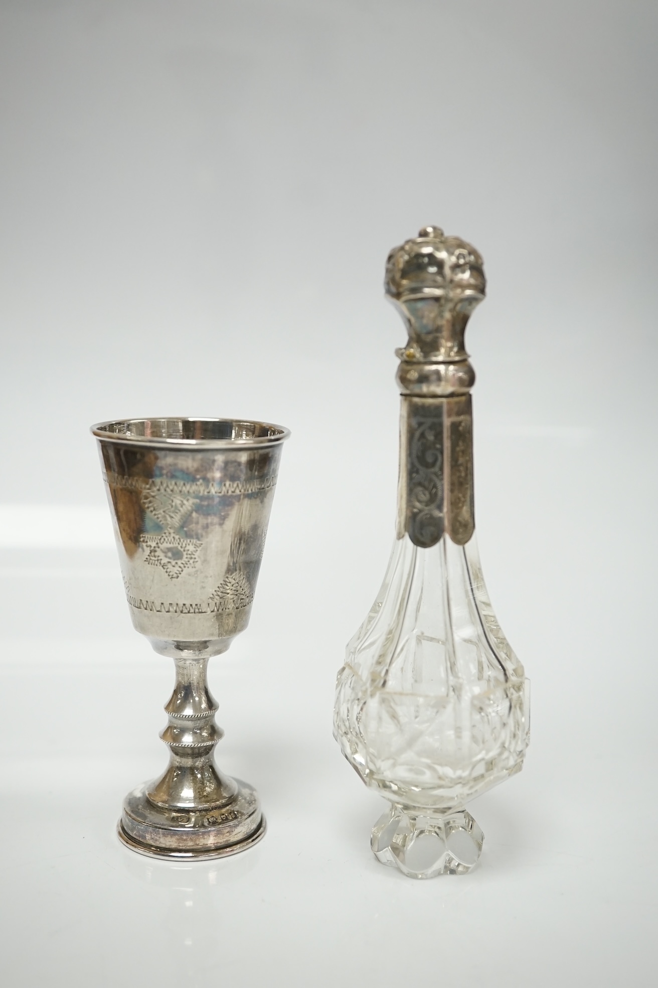 A small collection of miniature silver and white metal items including a cot by Saunders & Shepherd, Birmingham, 1896, 57mm, two filigree items, two Kiddush cups etc. Condition - poor to fair